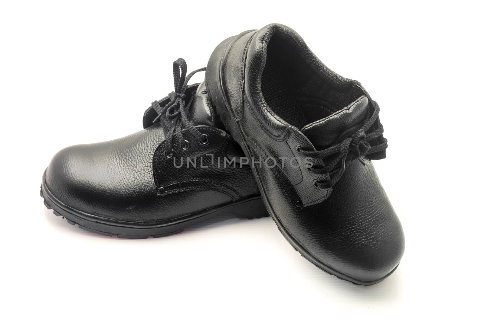 Protective workwear black safety shoes on white background.