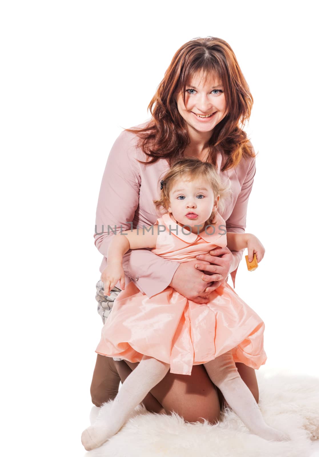 Mother holding ywo years daughter isolated on white