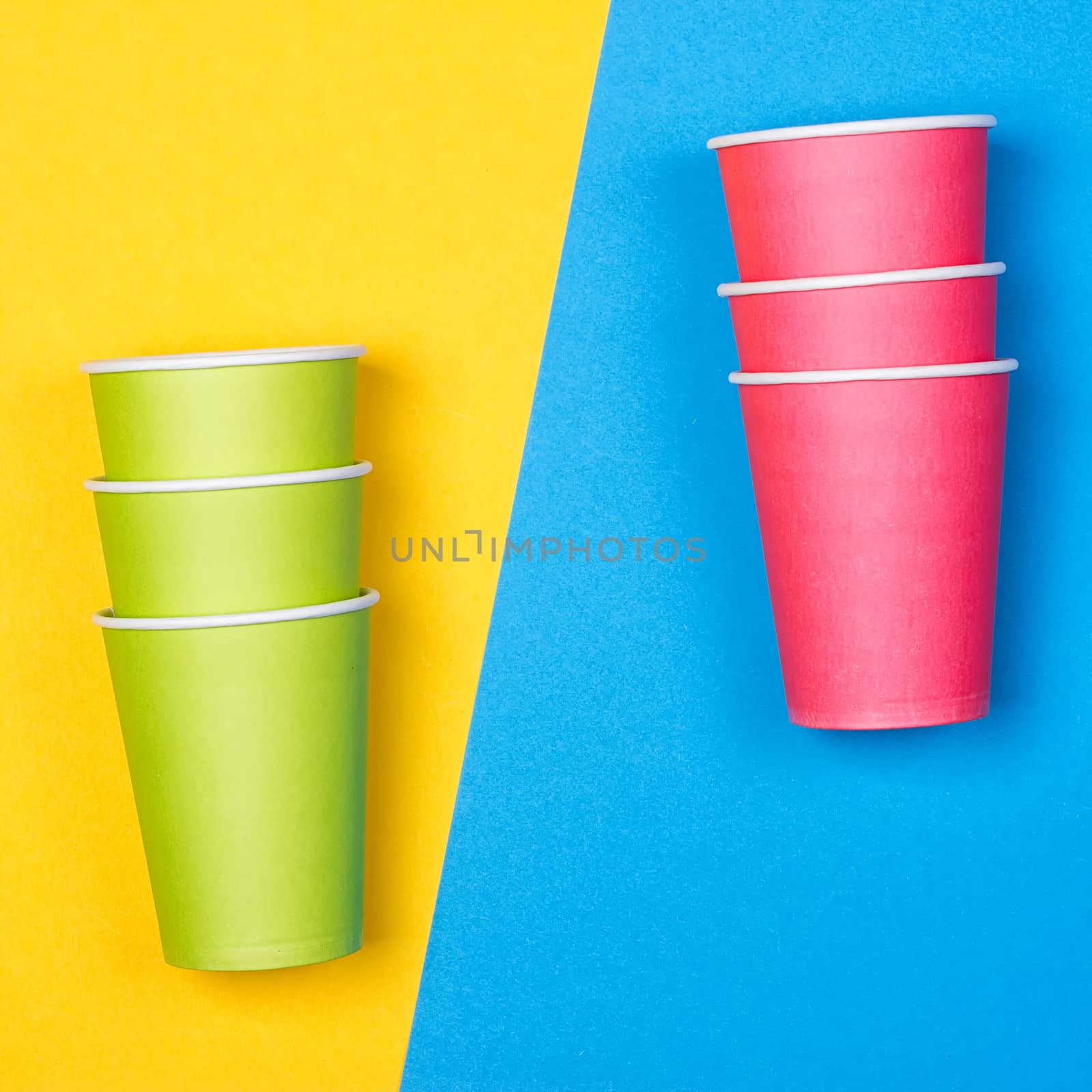 Paper cups on the Yellow and blue background by victosha