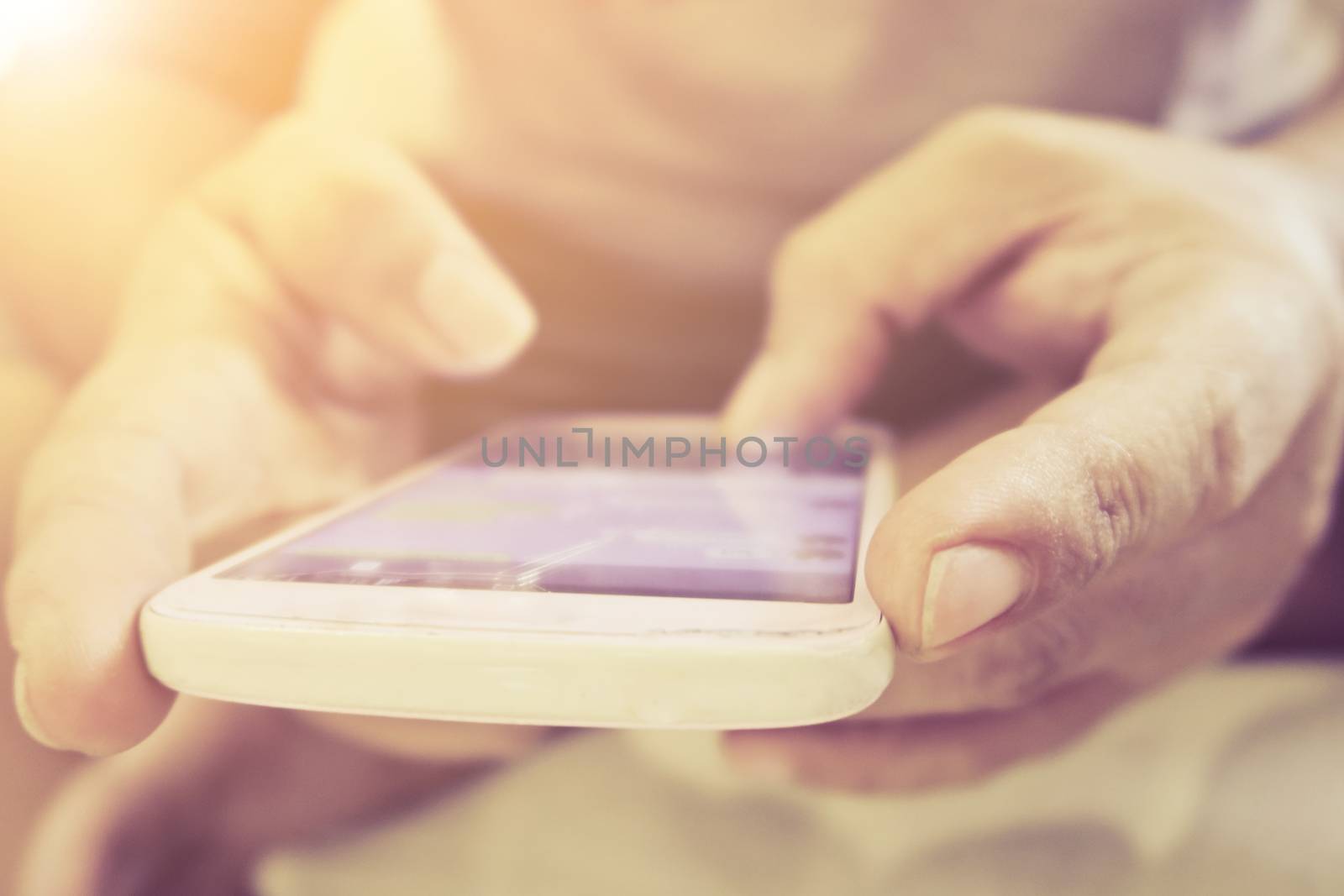 close up of hand typing on phone