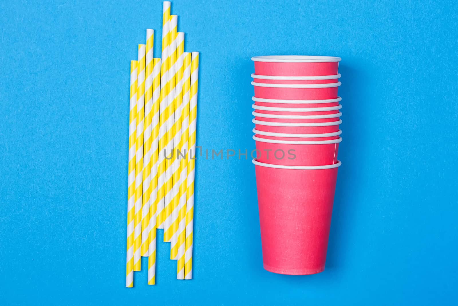 Colorful paper cups and striped straws by victosha