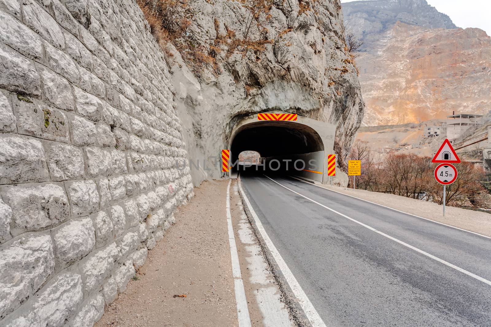 Tunnel on the road in the canyon by vladimirnenezic