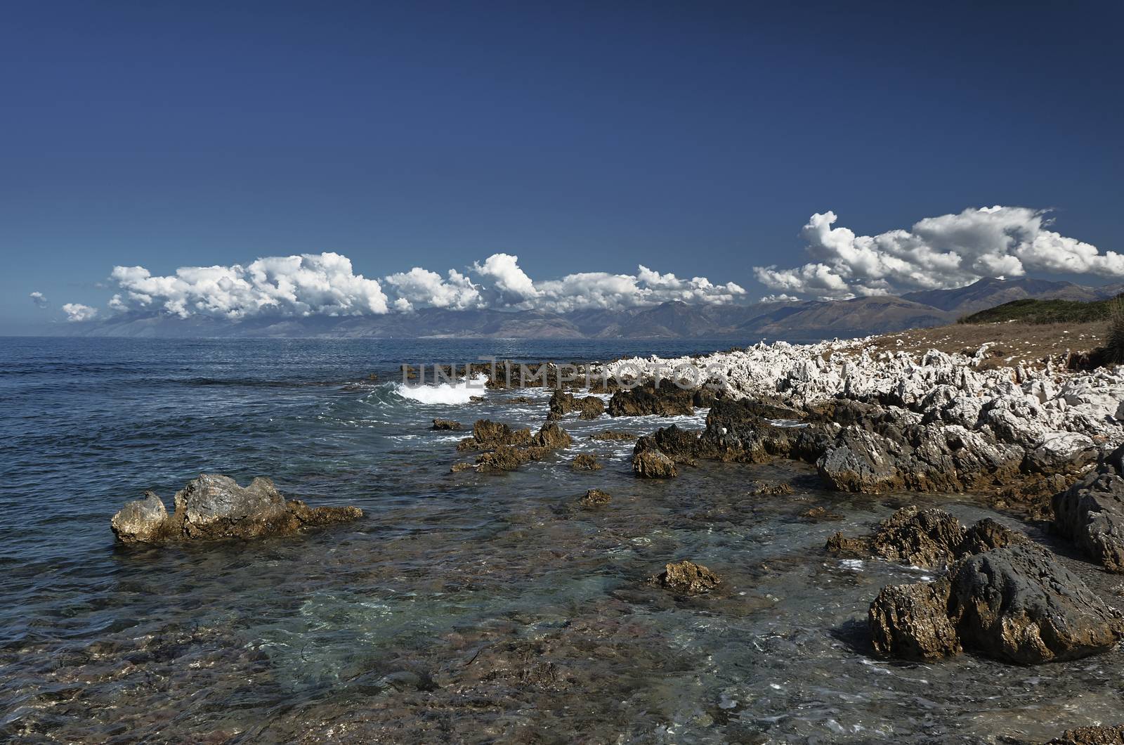 coast of island of Corfu with white rock
