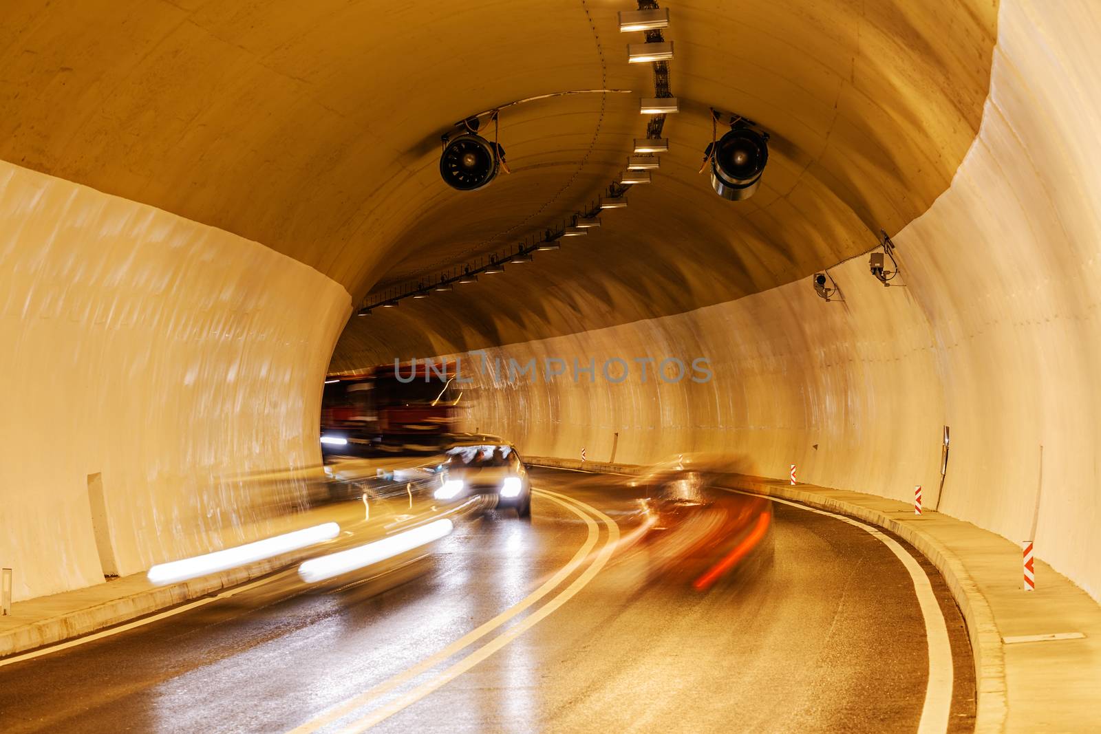 Tunnel with lights and moving cars