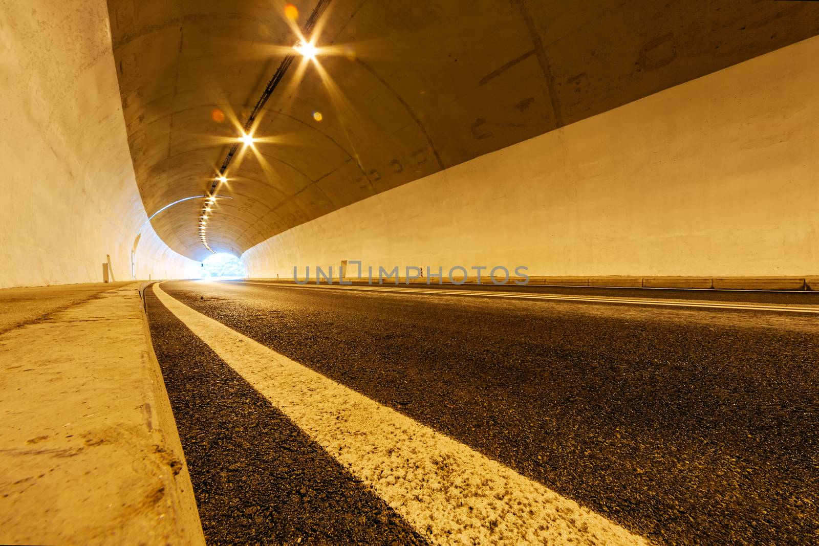 Tunnel with lights and moving cars
