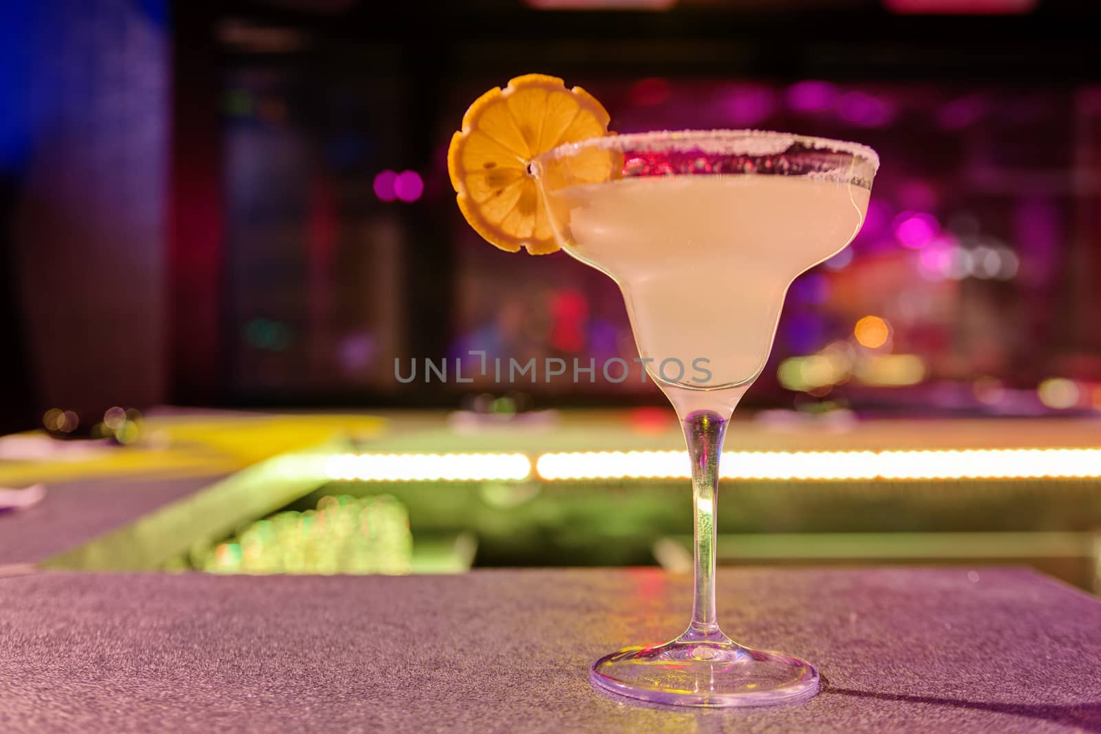cocktail at bar in a night club with vivid colors
