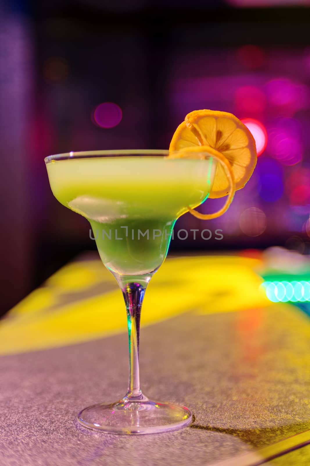 cocktail at bar in a night club with vivid colors