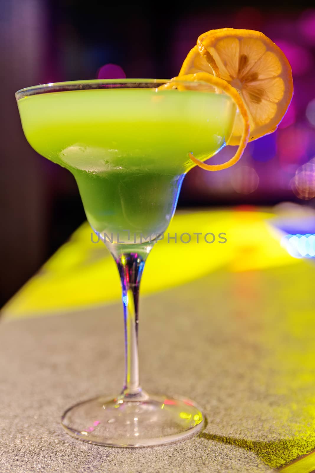 cocktail at bar in a night club with vivid colors