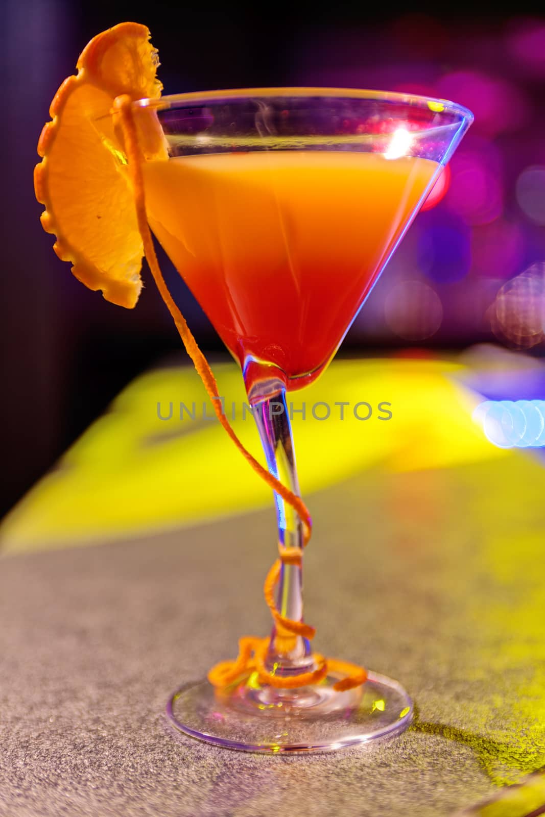 cocktail at bar in a night club with vivid colors