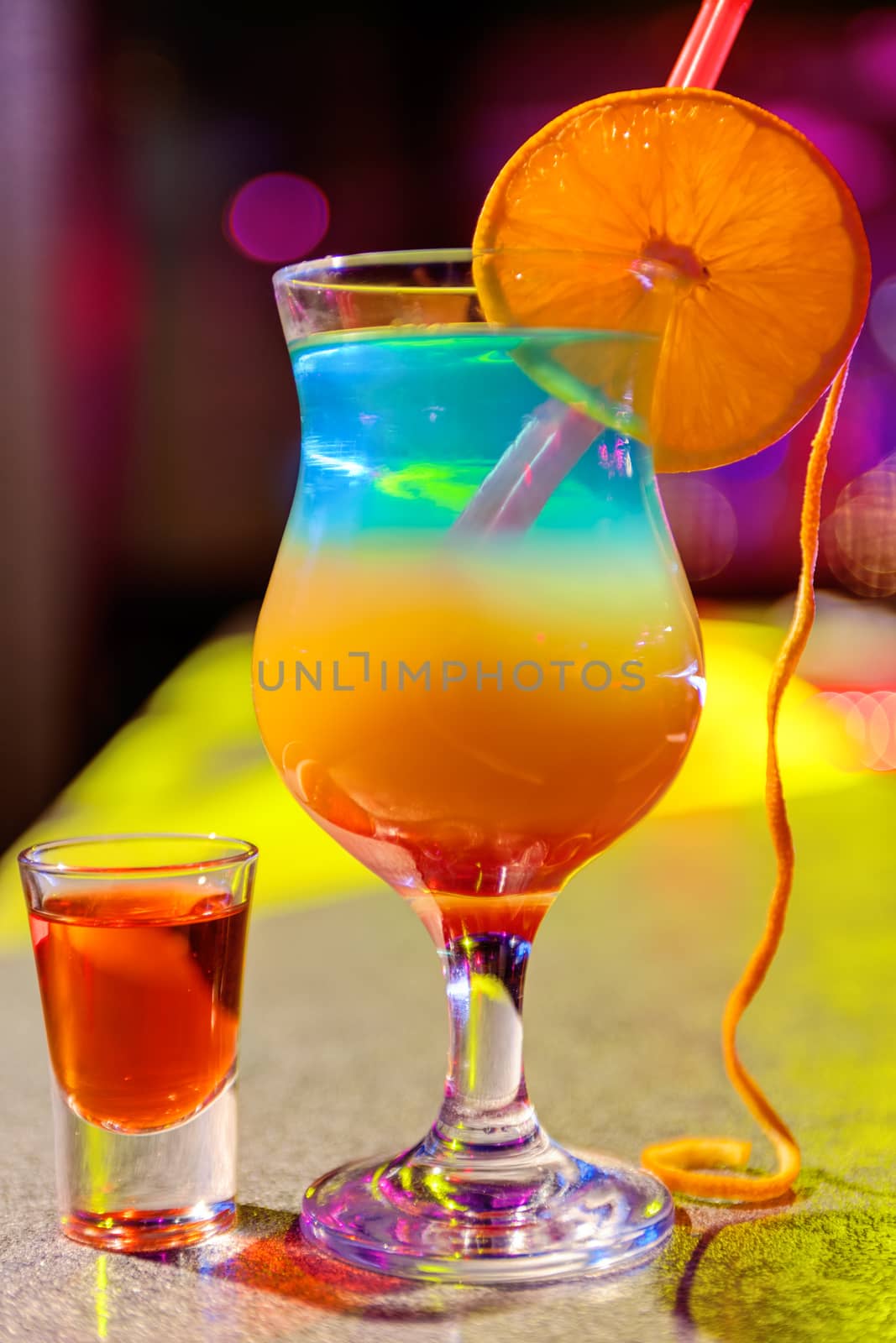 cocktail at bar in a night club with vivid colors