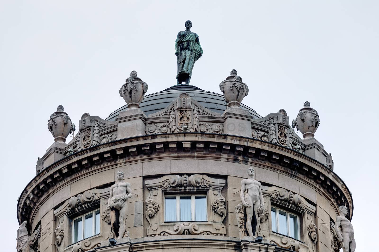 Details of stone facade with ornaments and statues