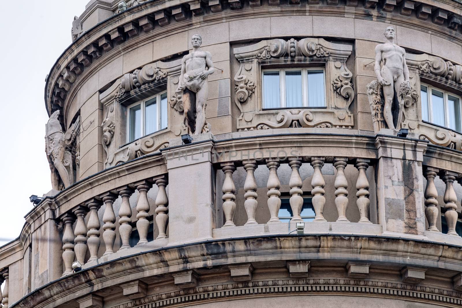 Details of stone facade with ornaments and statues