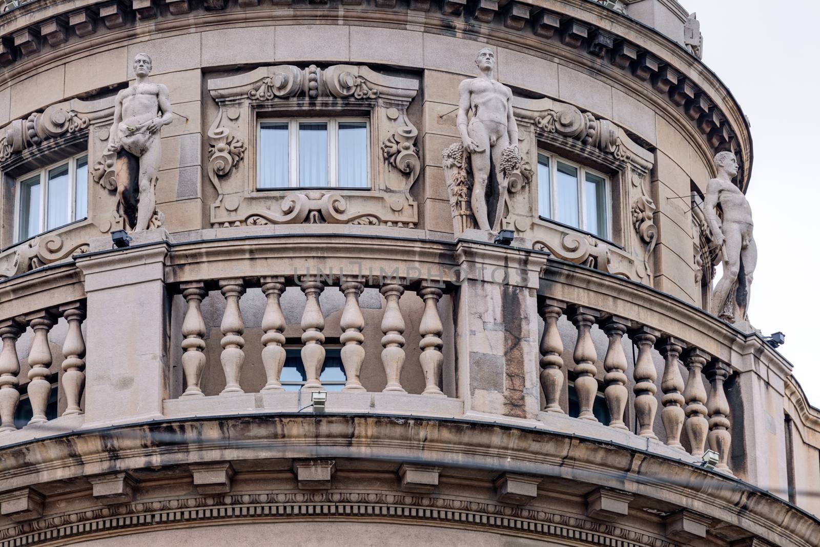 Details of stone facade with ornaments and statues