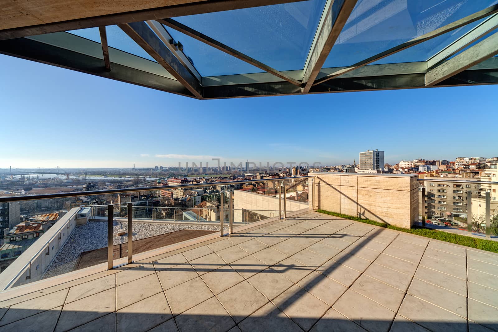 Terrace with metal and glass construction in modern building