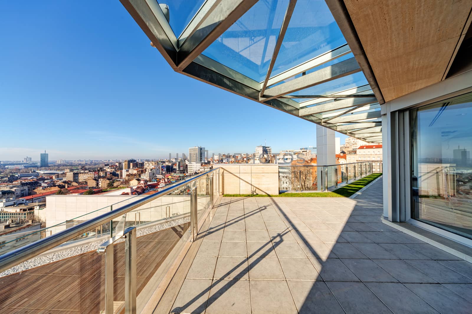 Terrace with metal and glass construction in modern building