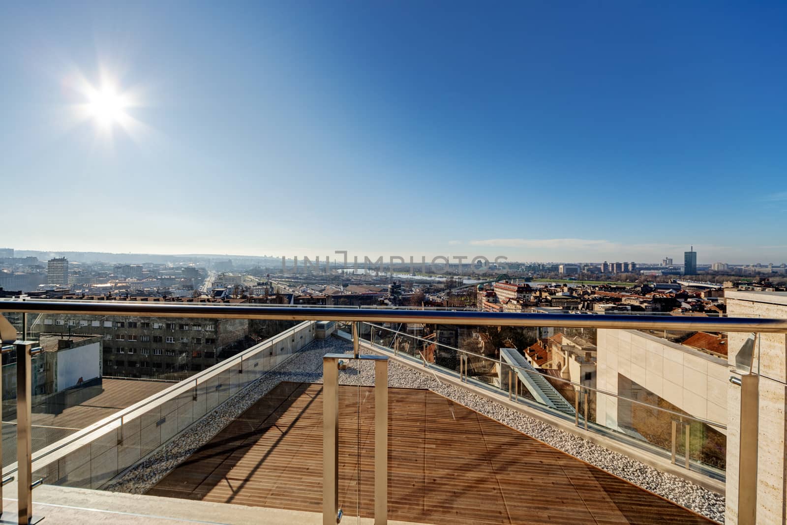 Terrace with metal and glass construction in modern building