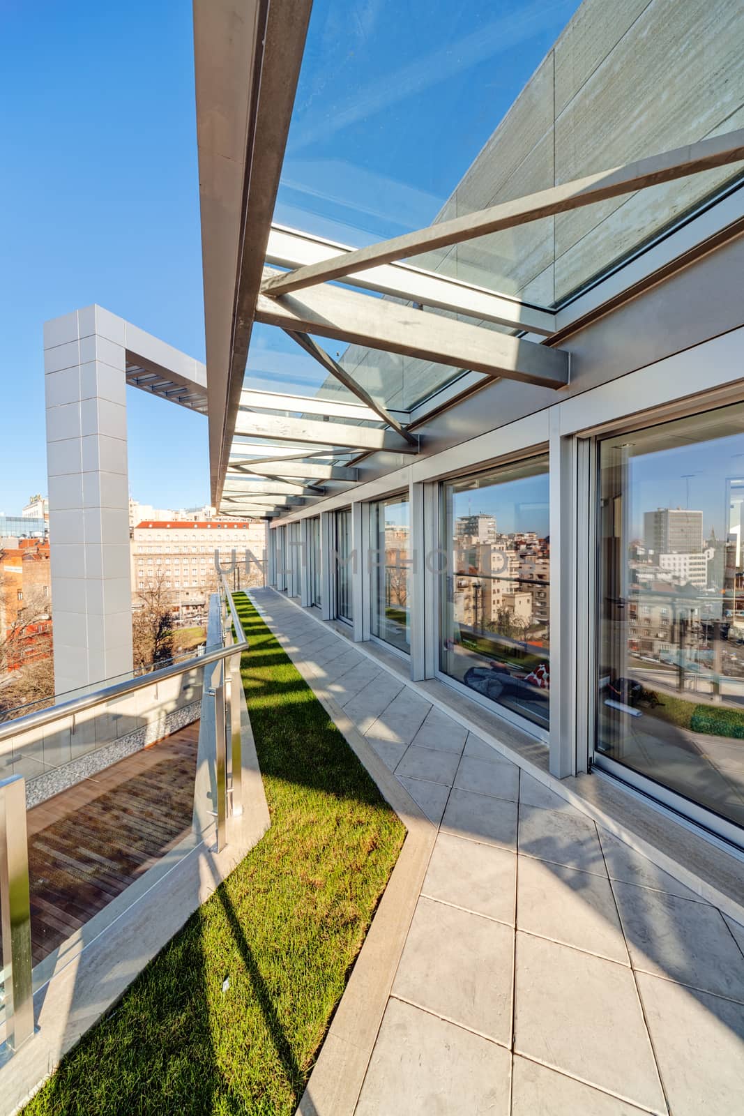 Terrace with metal and glass construction in modern building