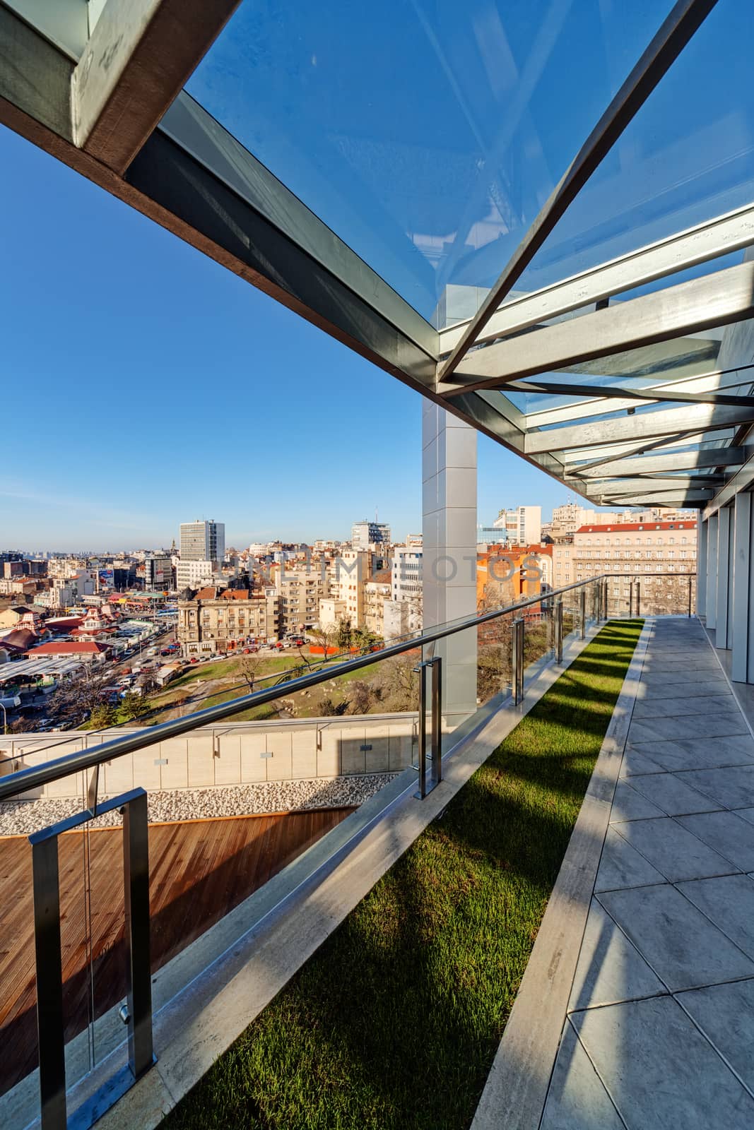 Terrace with metal and glass construction in modern building