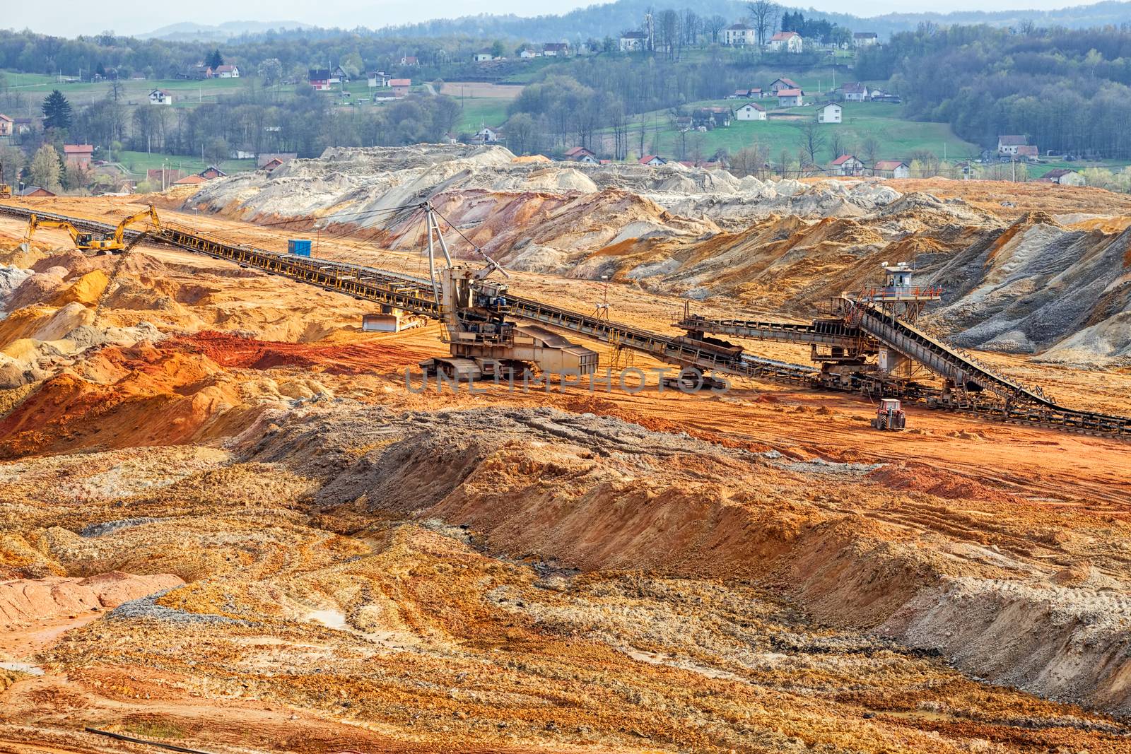 open coal mining pit with heavy machinery