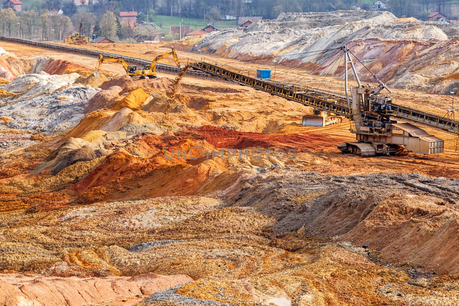 open coal mining pit with heavy machinery