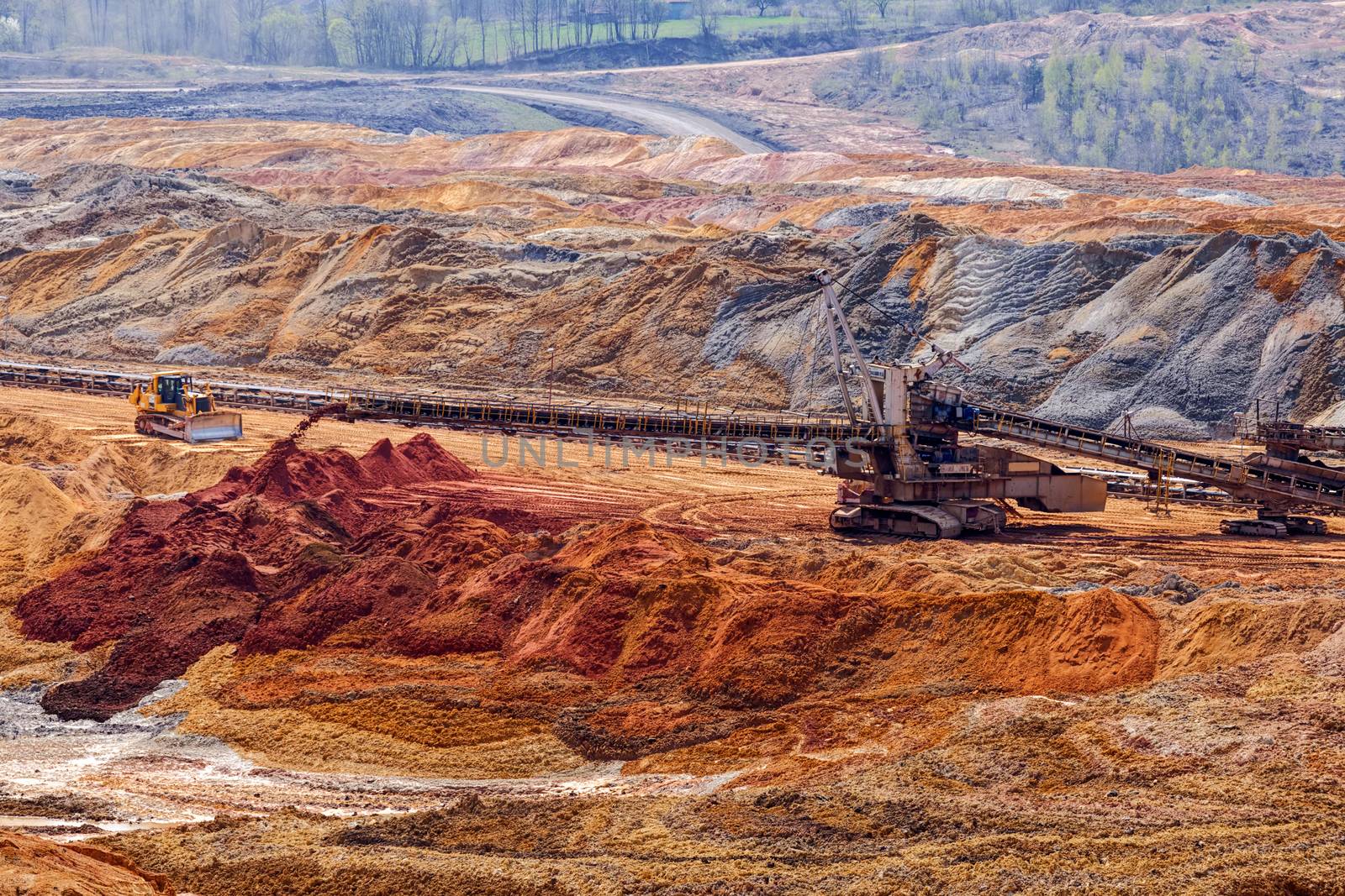 open mining pit with heavy machinery