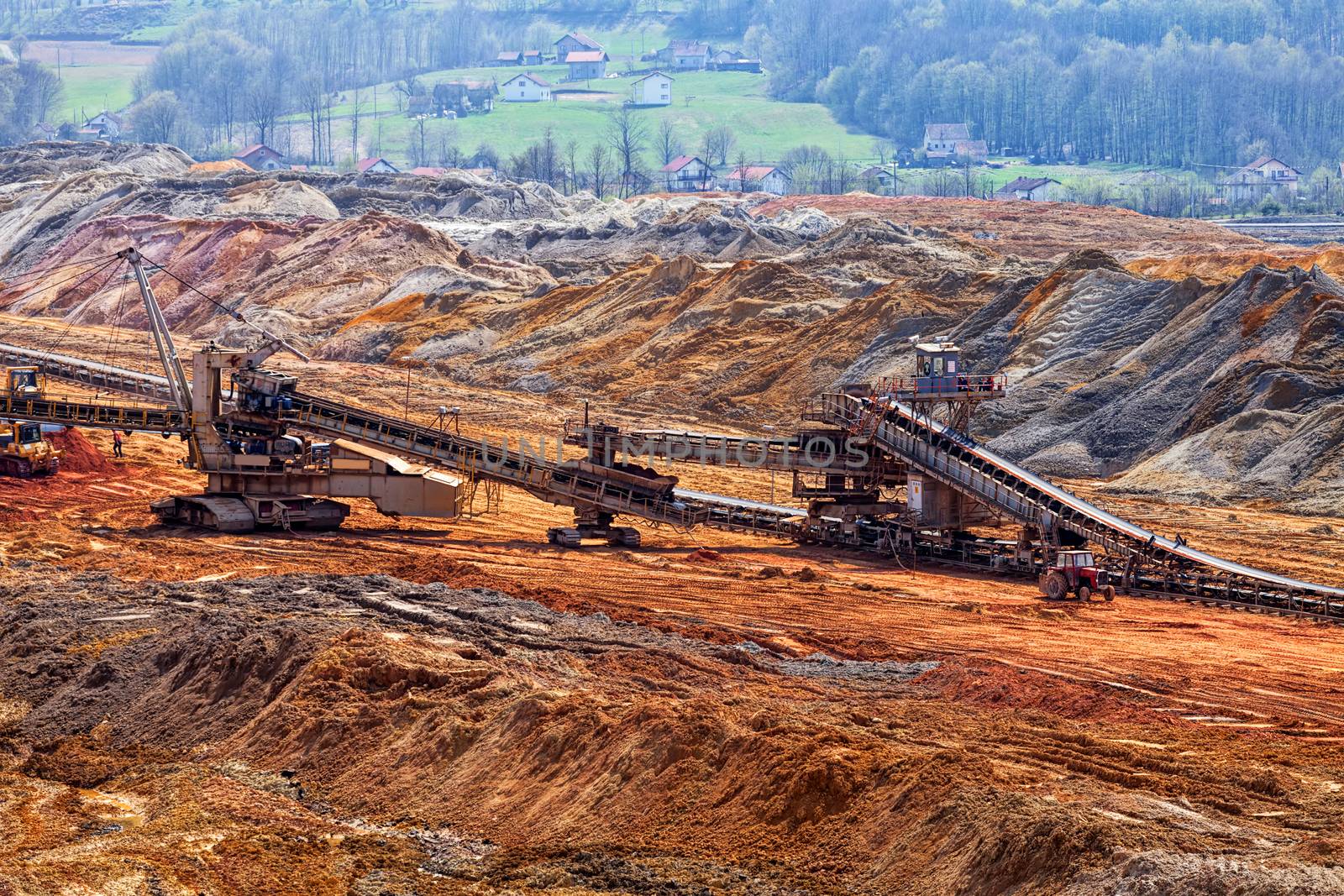 open coal mining pit with heavy machinery