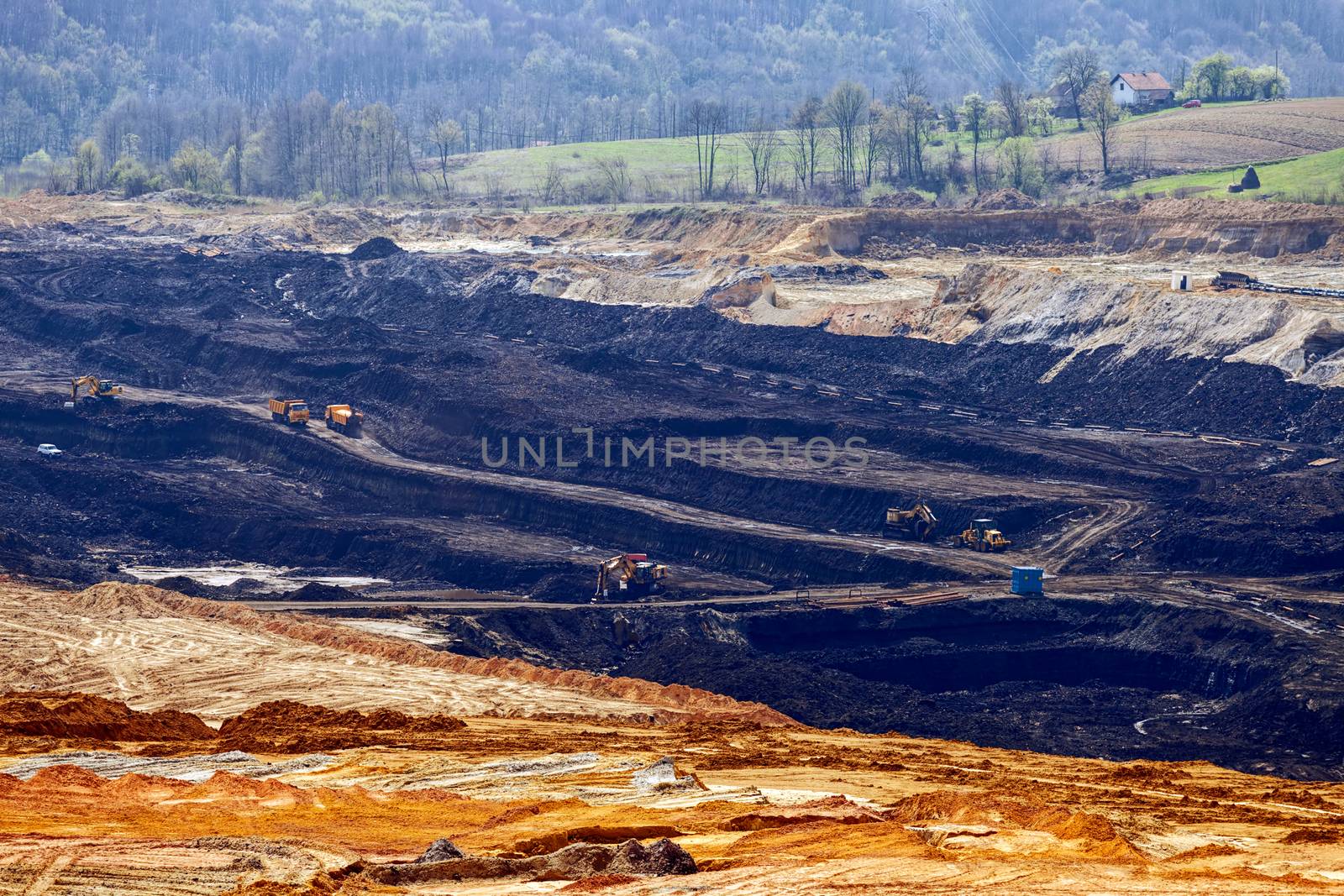 open miming pit with heavy machinery