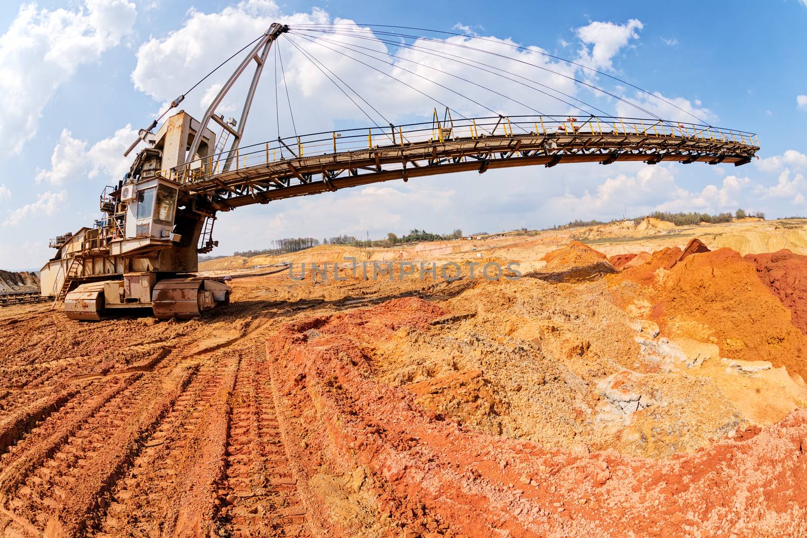 open coal mining pit with heavy machinery