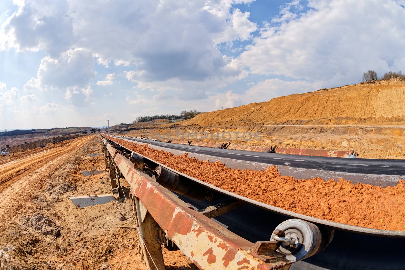 open mining pit with heavy machinery