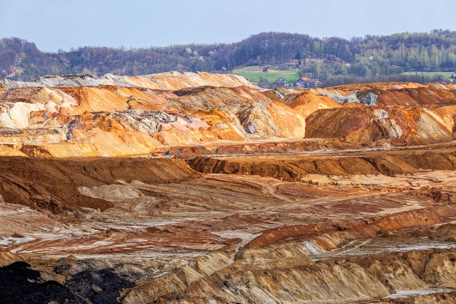 open coal mining pit with heavy machinery