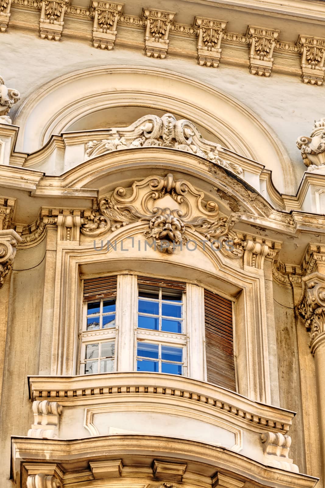 stone facade on classical building with ornaments and sculptures