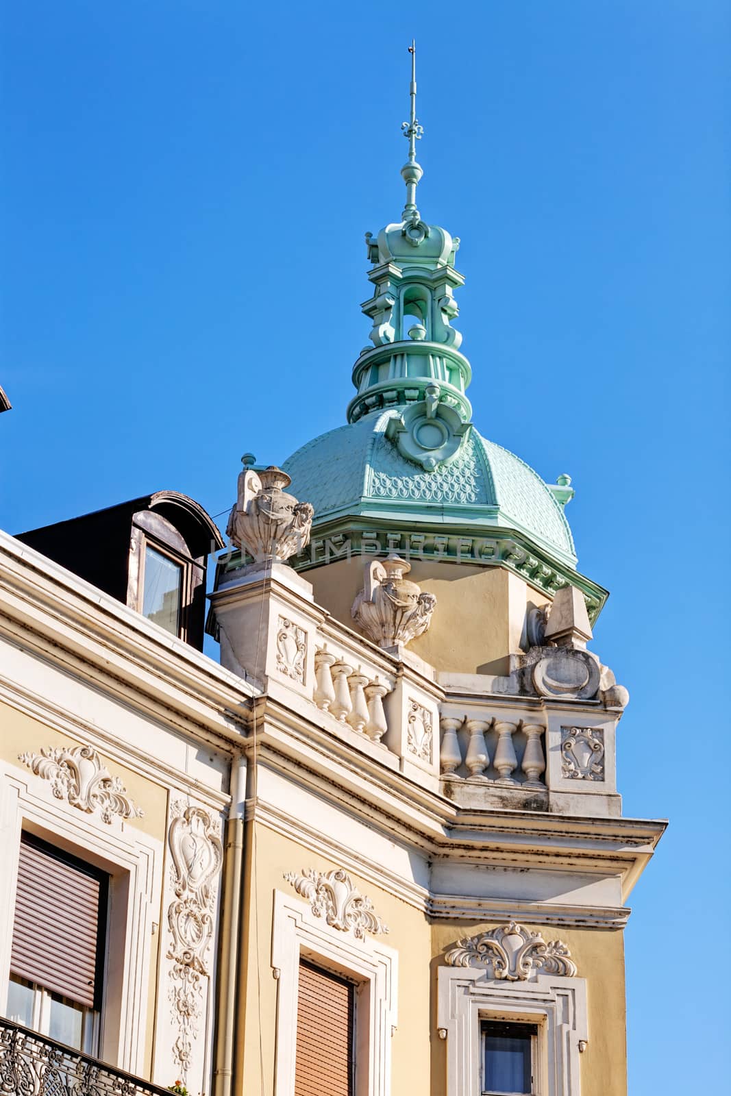 Stone facade on classical building with ornaments and sculptures