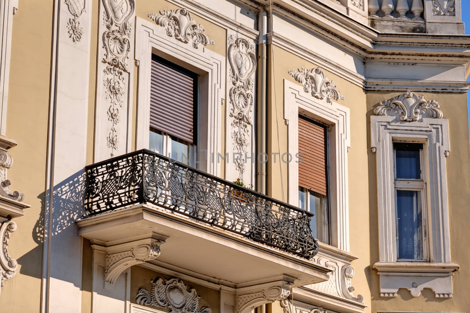 stone facade on classical building with ornaments and sculptures