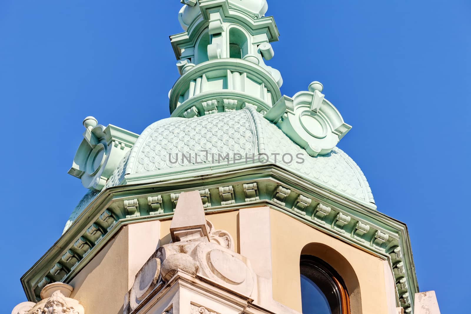 Stone facade on classical building with ornaments and sculptures