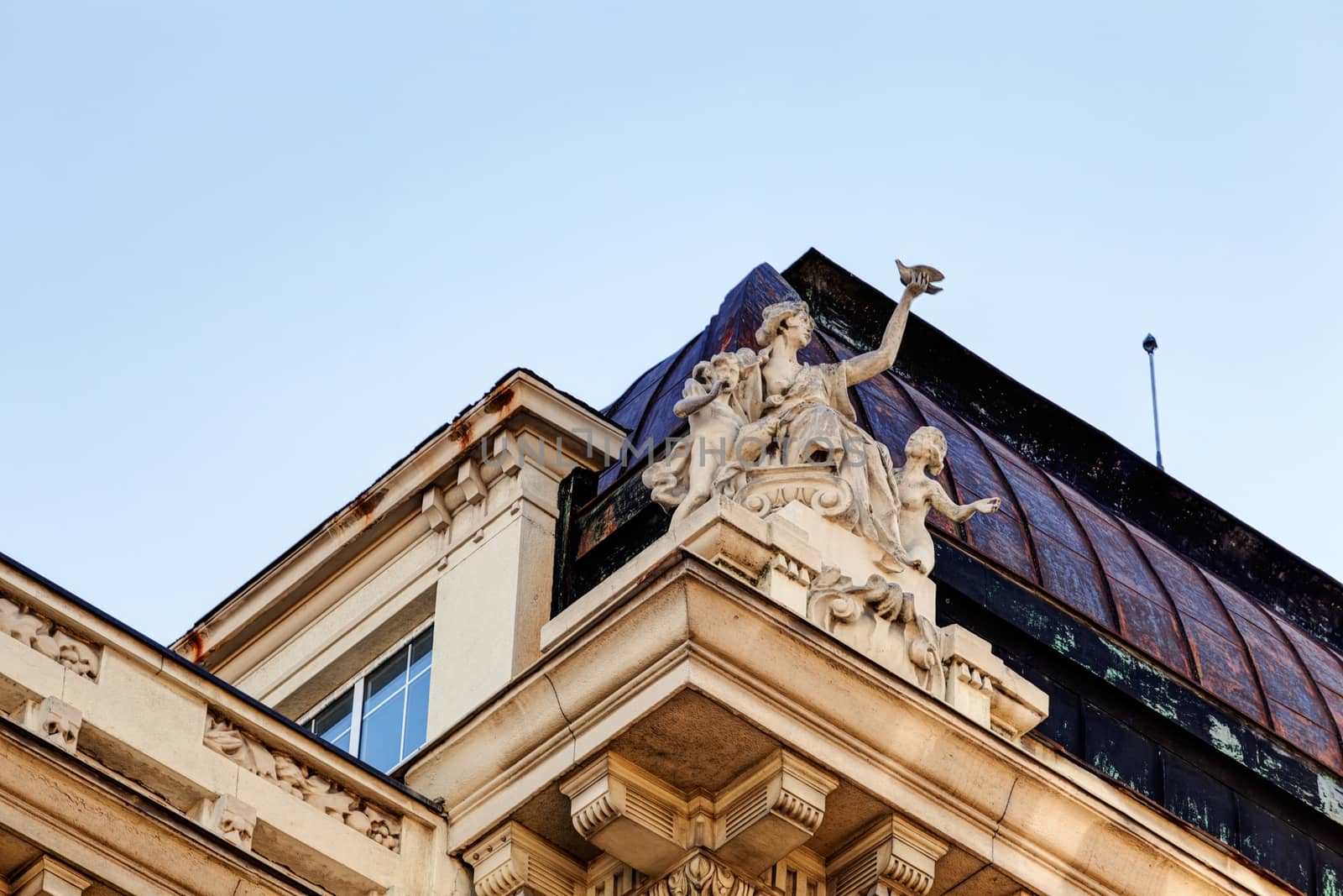 stone facade on classical building with ornaments and sculptures