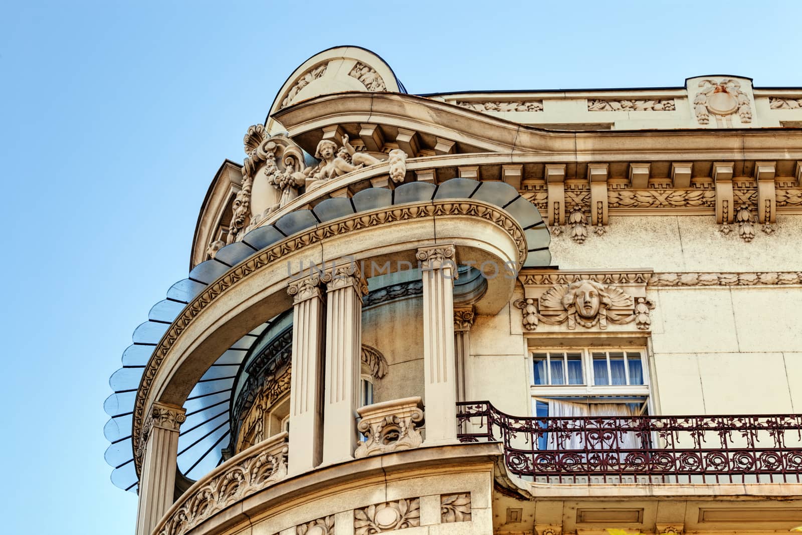 stone facade on classical building with ornaments and sculptures