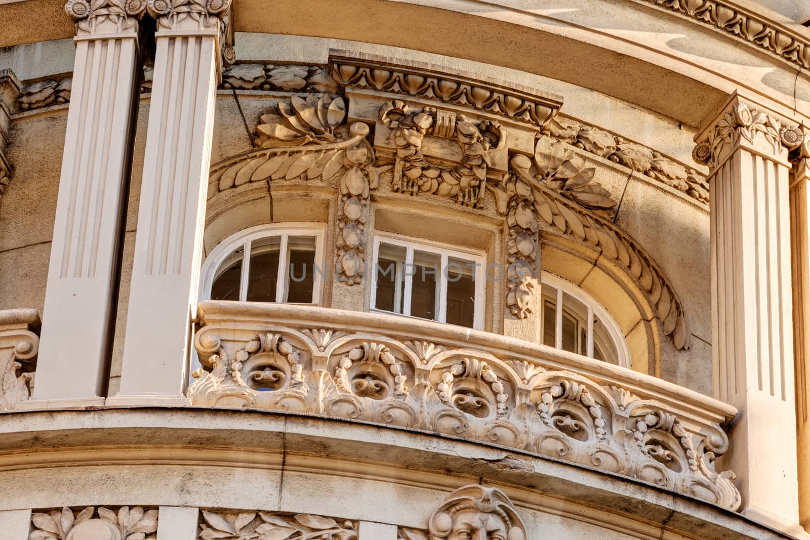 stone facade on classical building with ornaments and sculptures