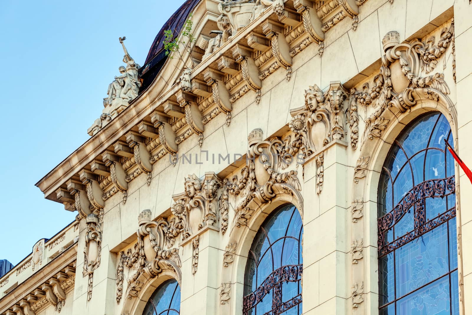 stone facade on classical building with ornaments and sculptures