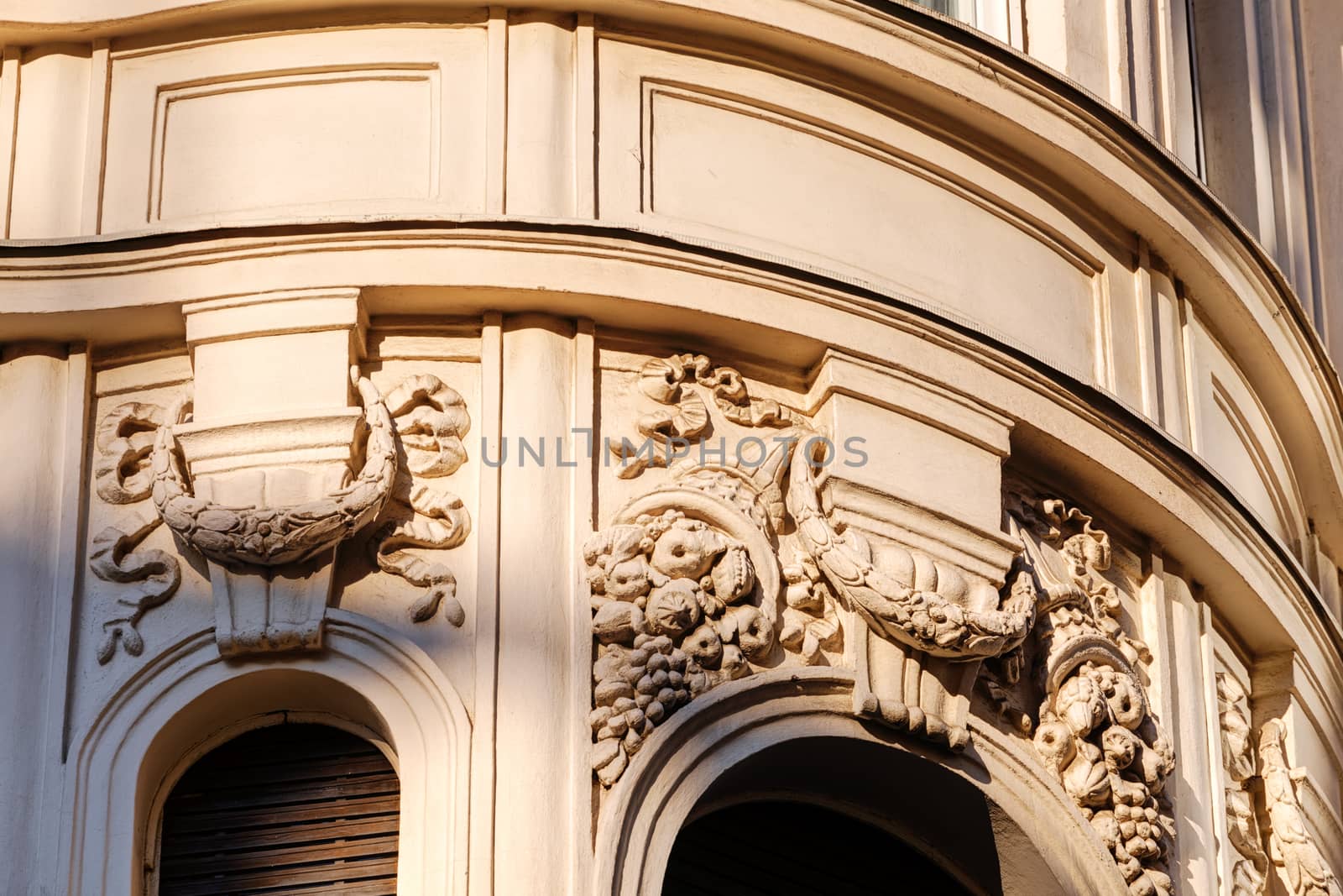 stone facade on classical building with ornaments and sculptures