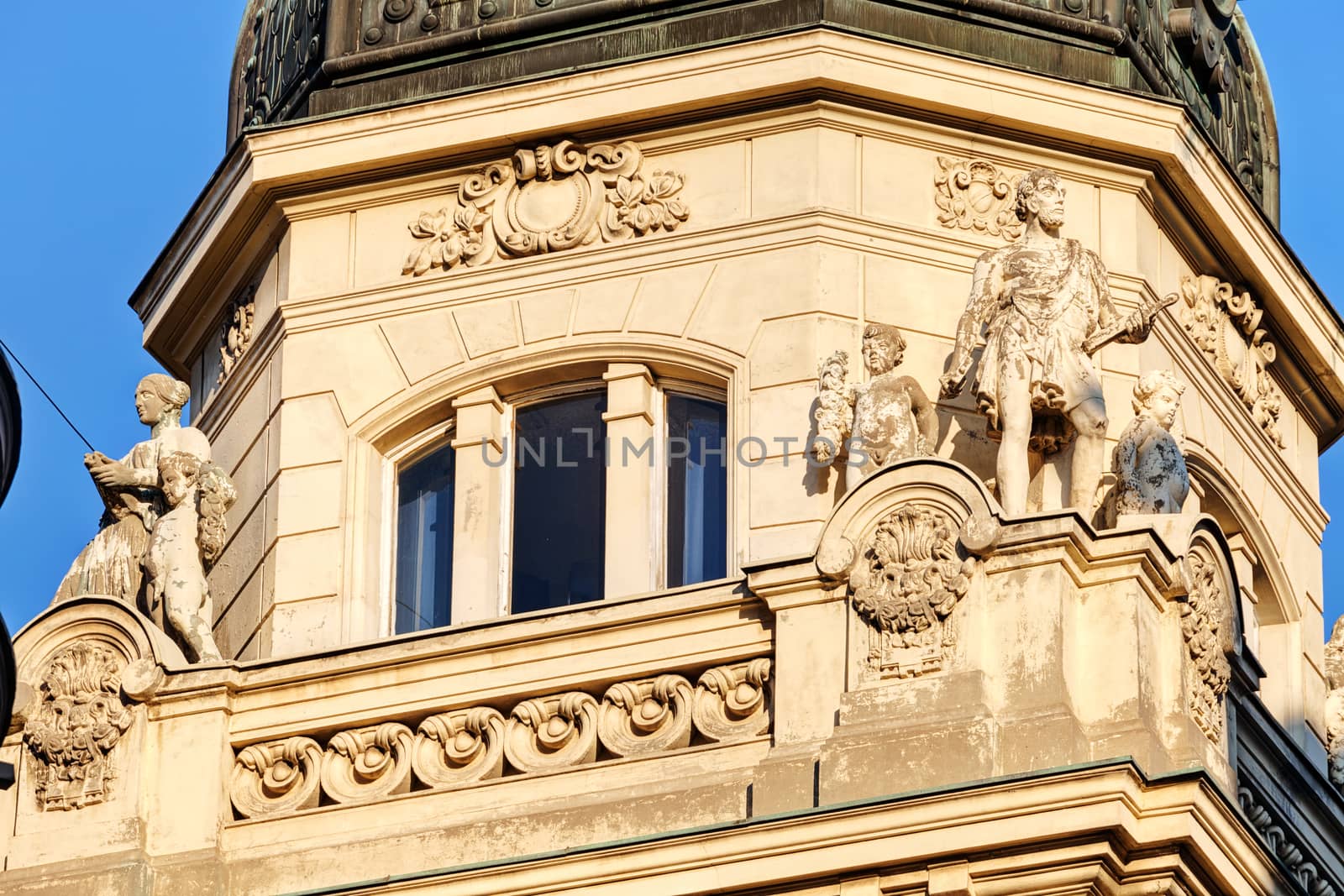 stone facade on classical building with ornaments and sculptures