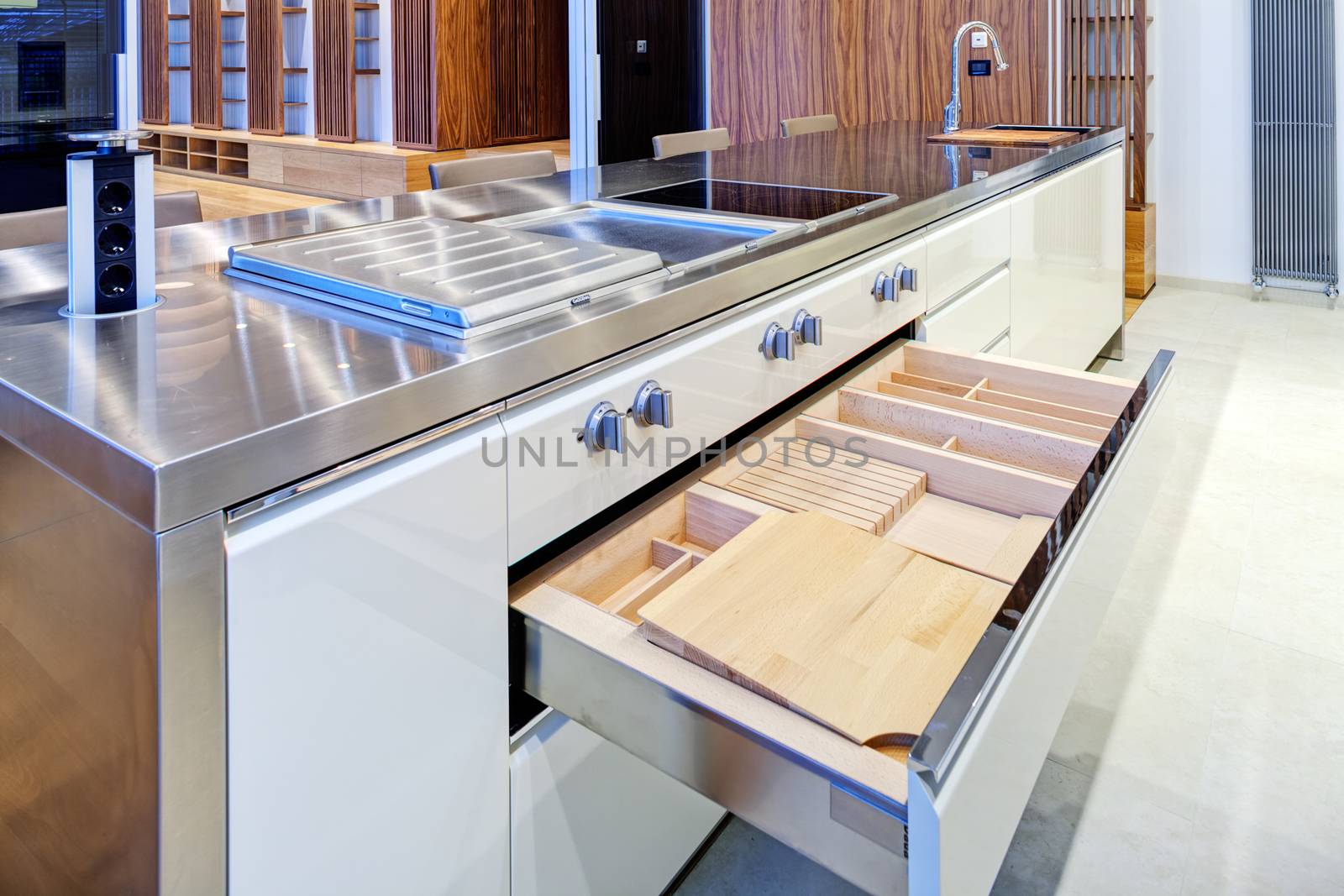 Modern kitchen interior with stainless steel sink and appliances