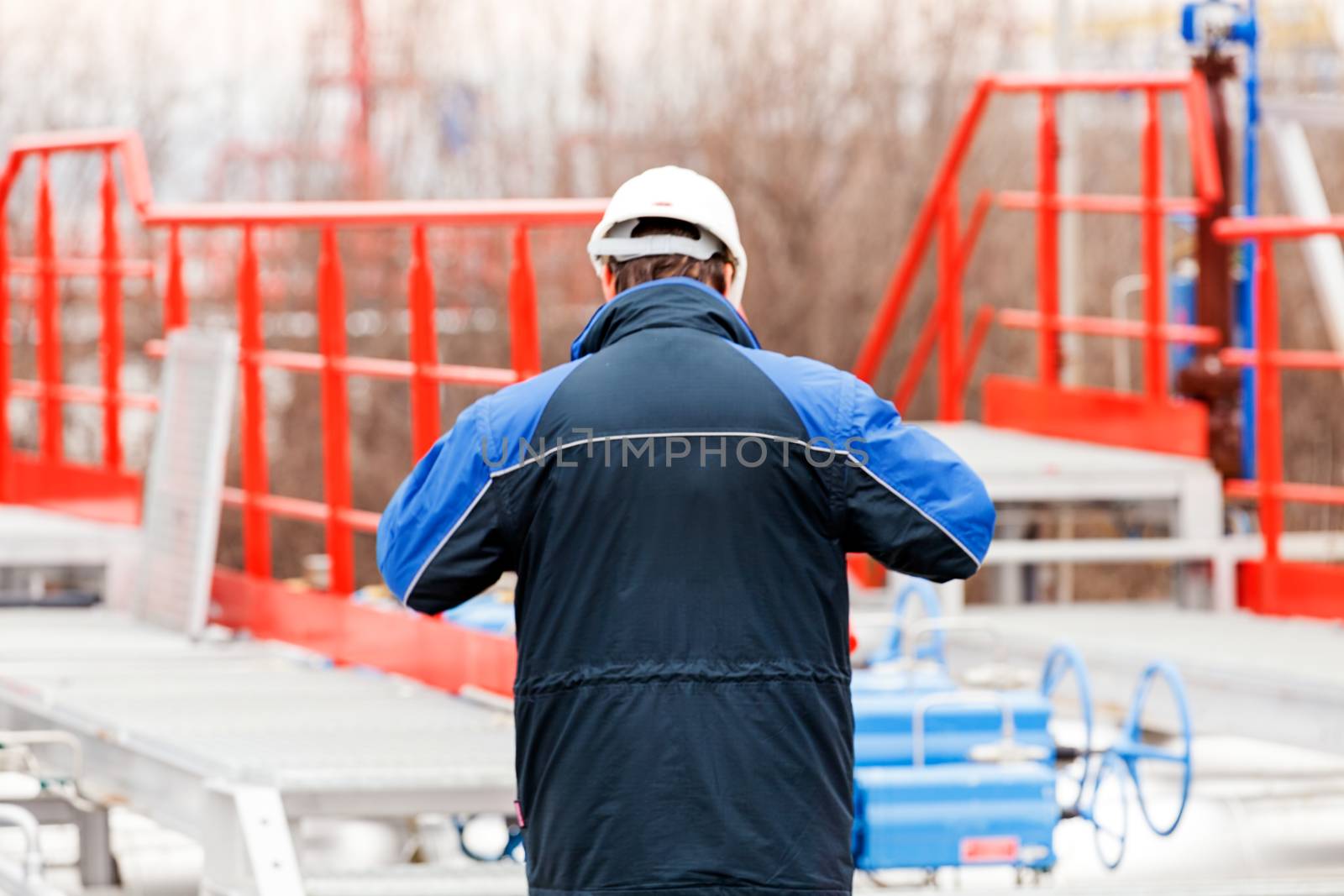 detail of oil pipeline with valves in large oil refinery