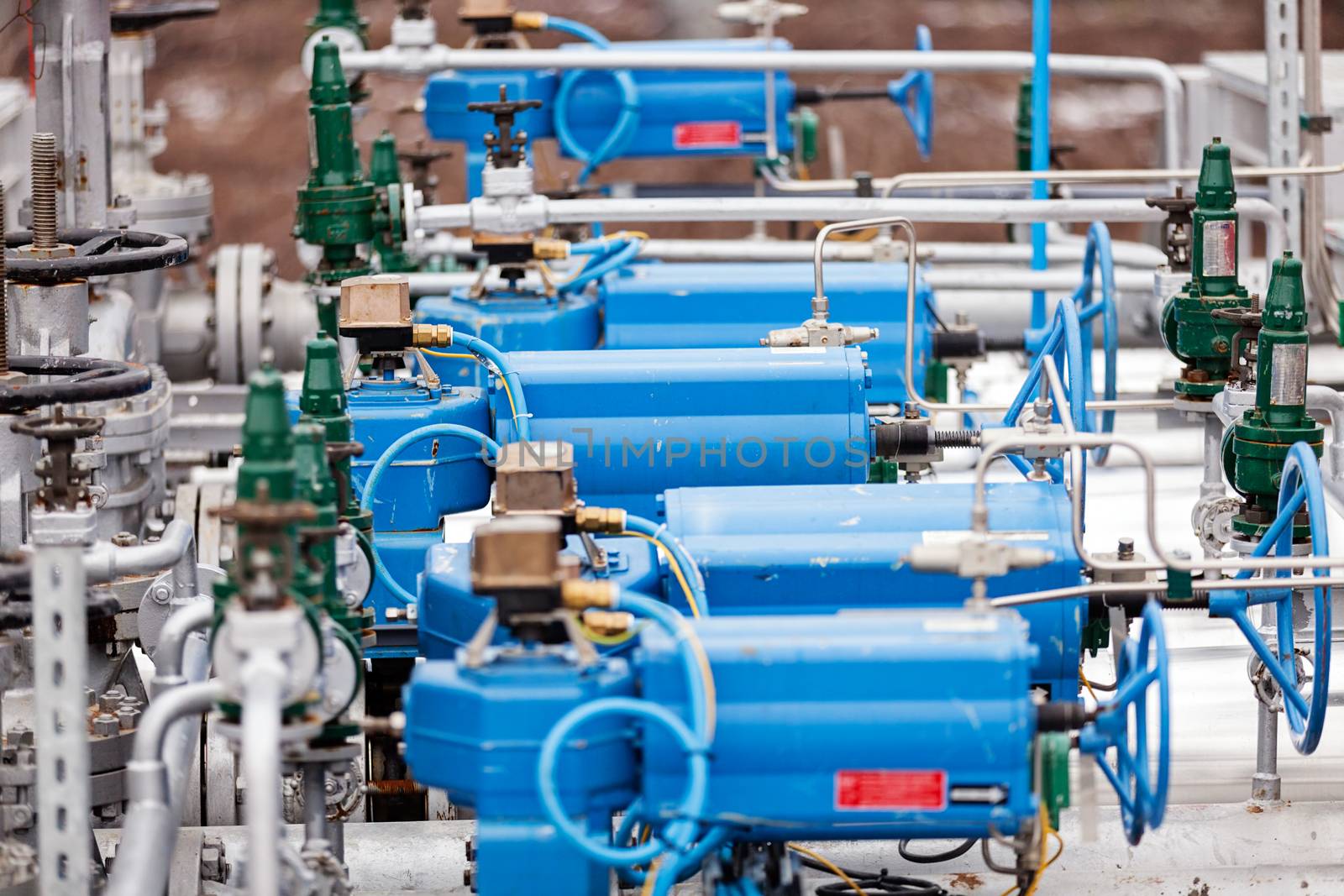 detail of oil pipeline with valves in large oil refinery