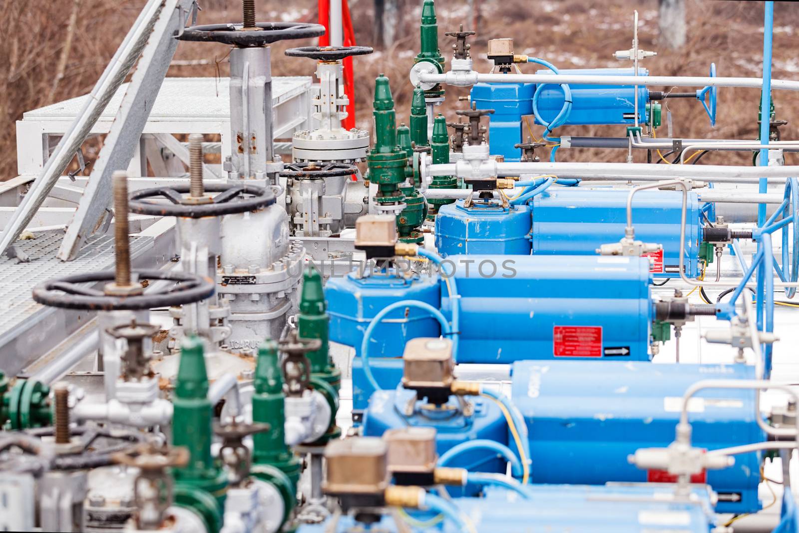 detail of oil pipeline with valves in large oil refinery