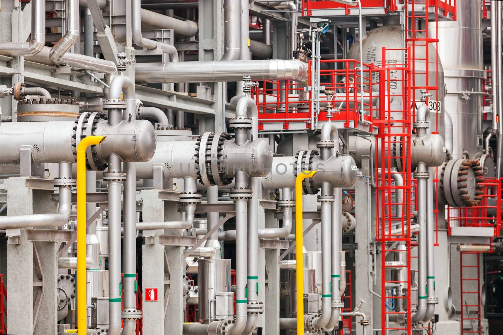 detail of oil pipeline with valves in large oil refinery