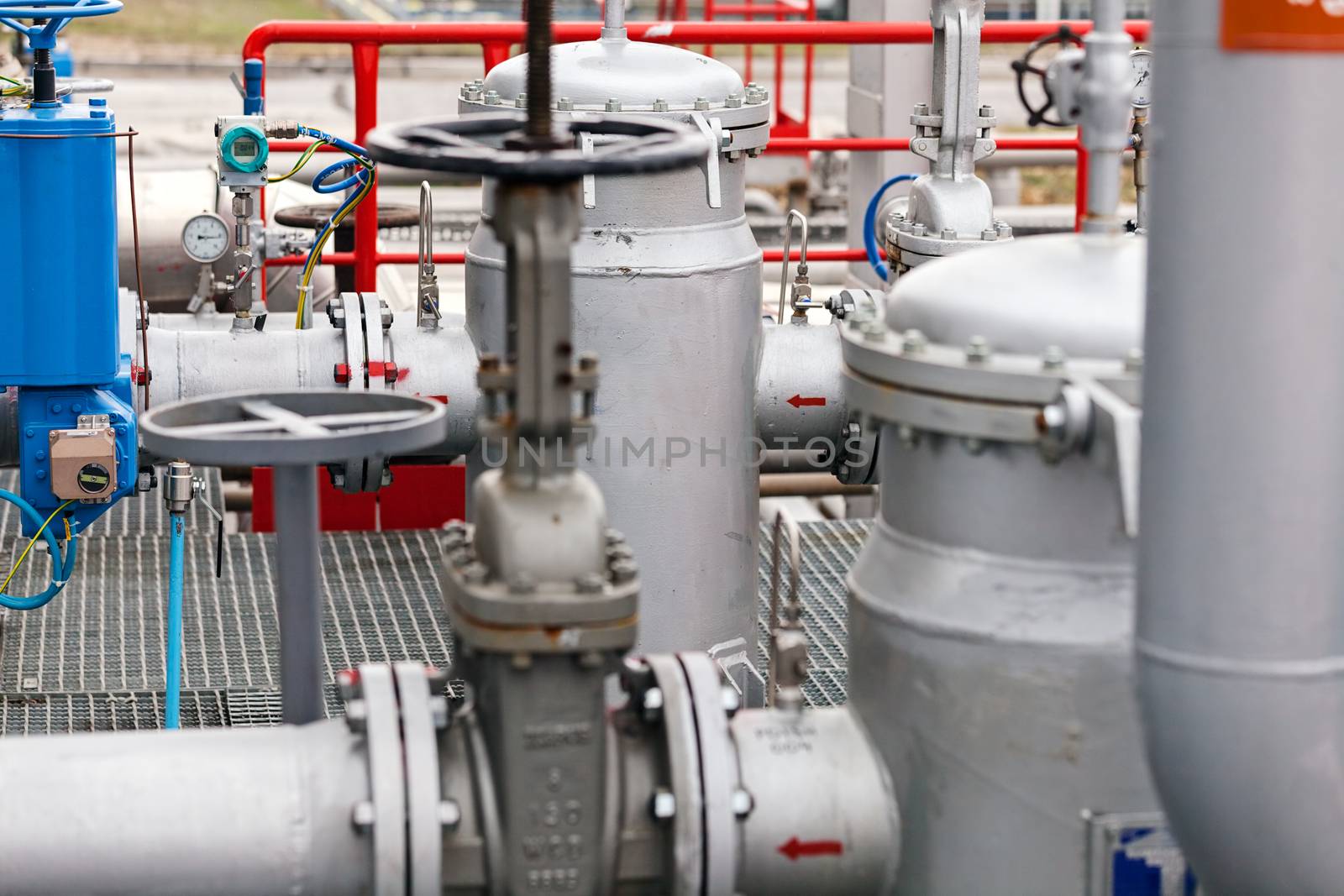 detail of oil pipeline with valves in large oil refinery