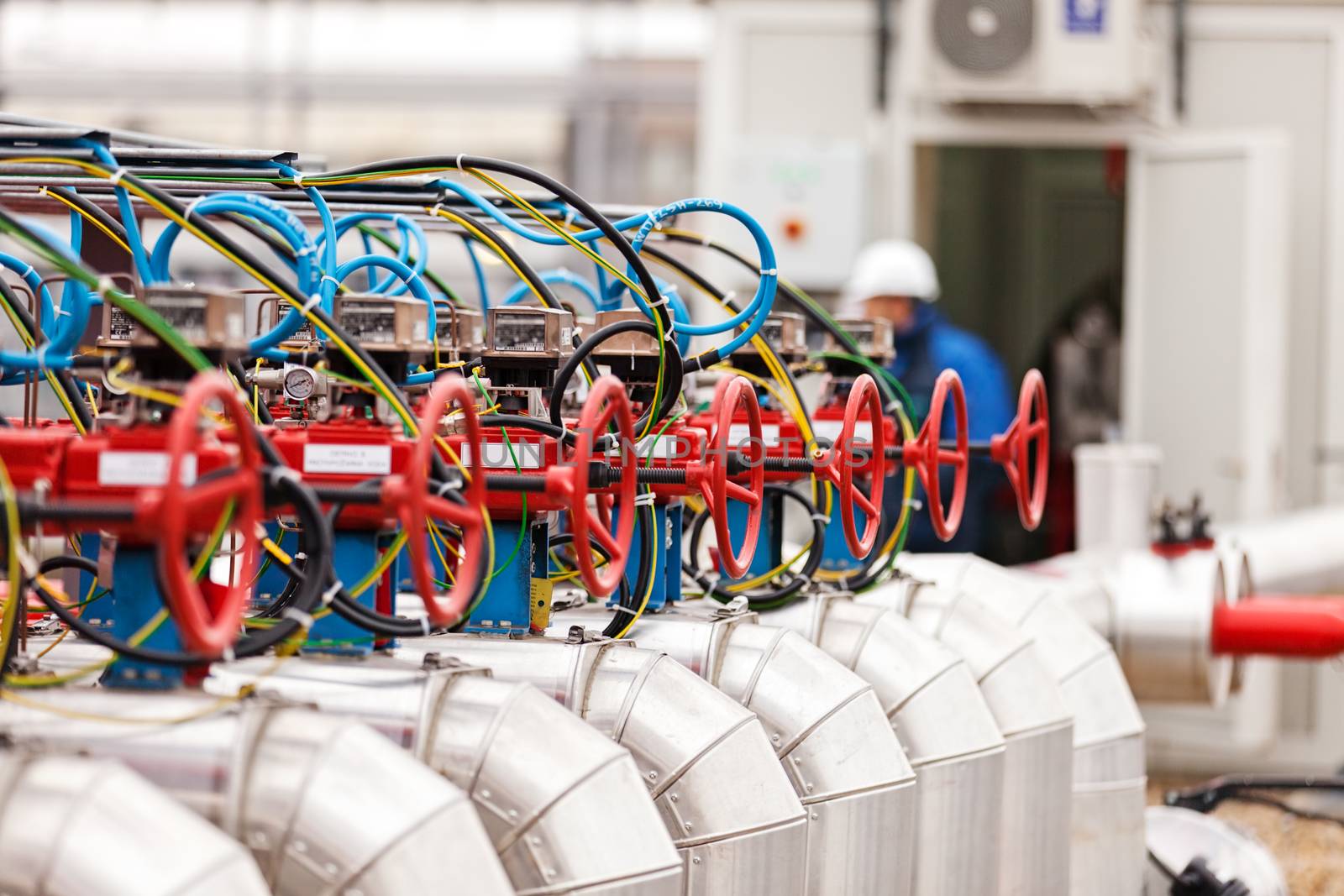 detail of oil pipeline with valves in large oil refinery