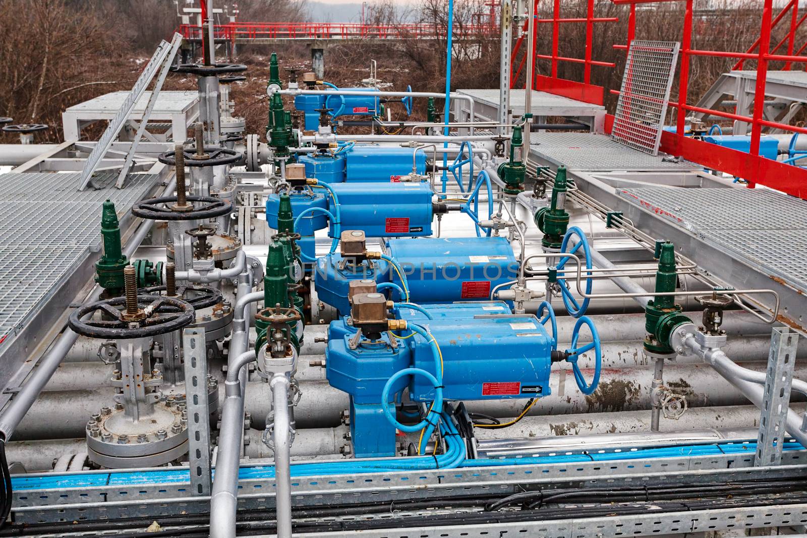 detail of oil pipeline with valves in large oil refinery