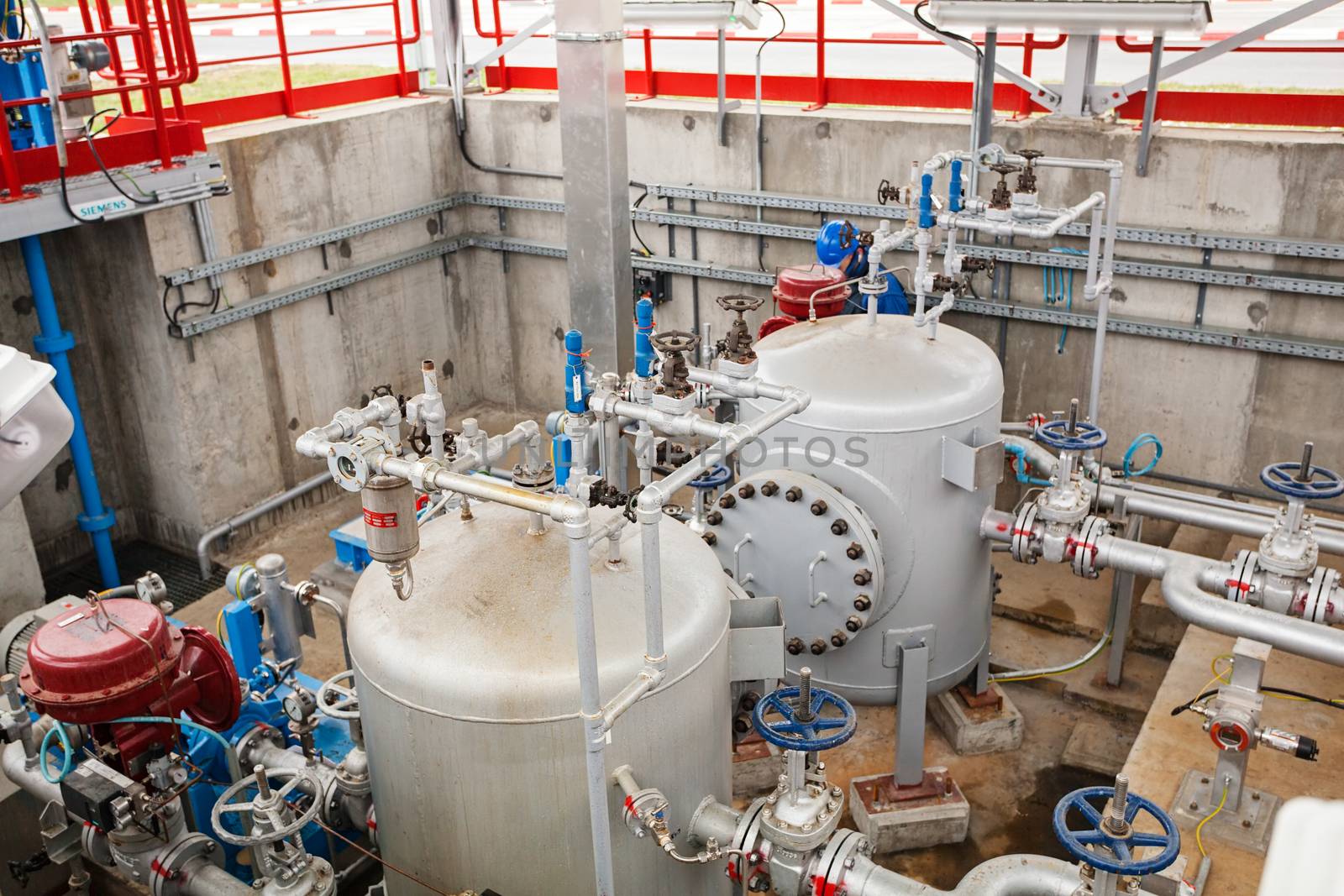 detail of oil pipeline with valves in large oil refinery