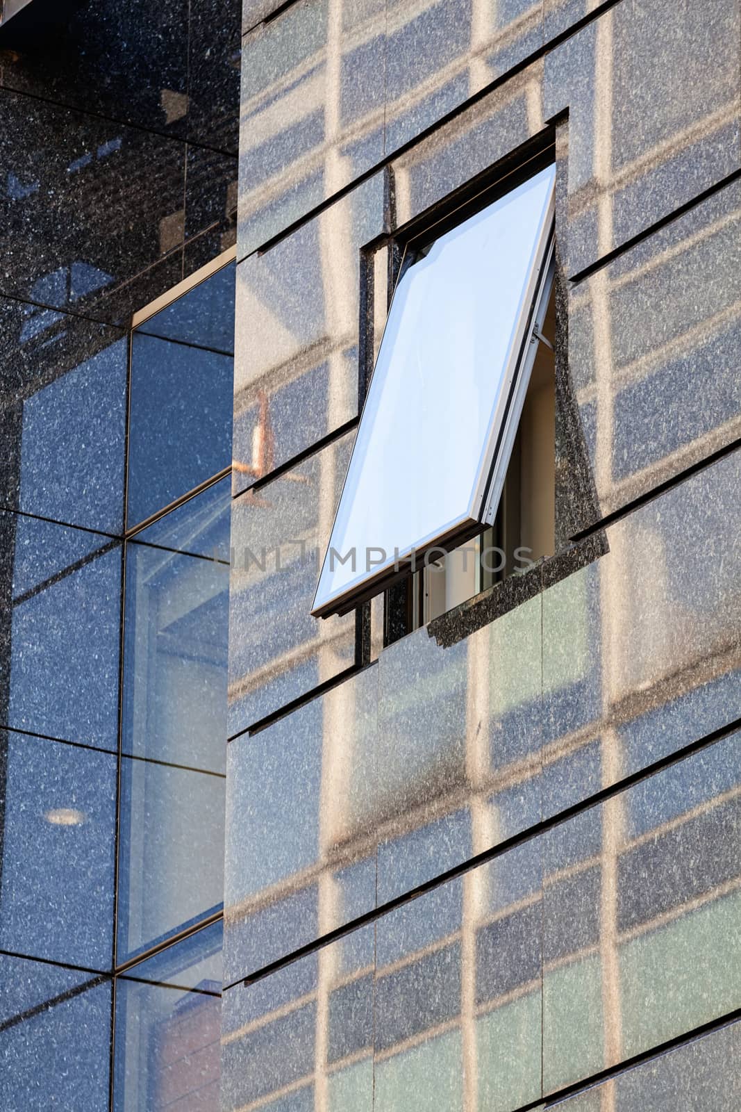 Modern building exterior with glass and metallic facade